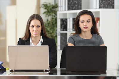 Two employees sitting next to each other