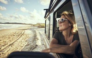 Image of woman looking at a beach