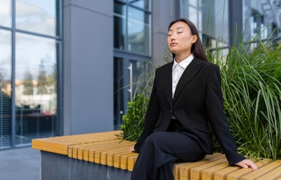 Businesswoman relaxing outside office