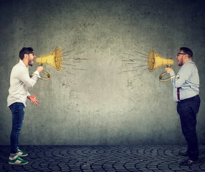 businessmen-screaming-into-a-megaphone-at-each-other