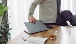 image of a worker shutting computer