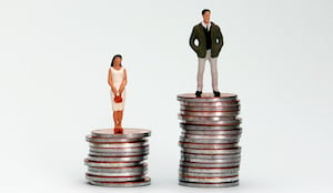 Image of man and woman on top of coins