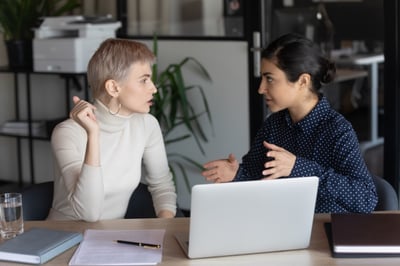 Manger discussing performance with employee.